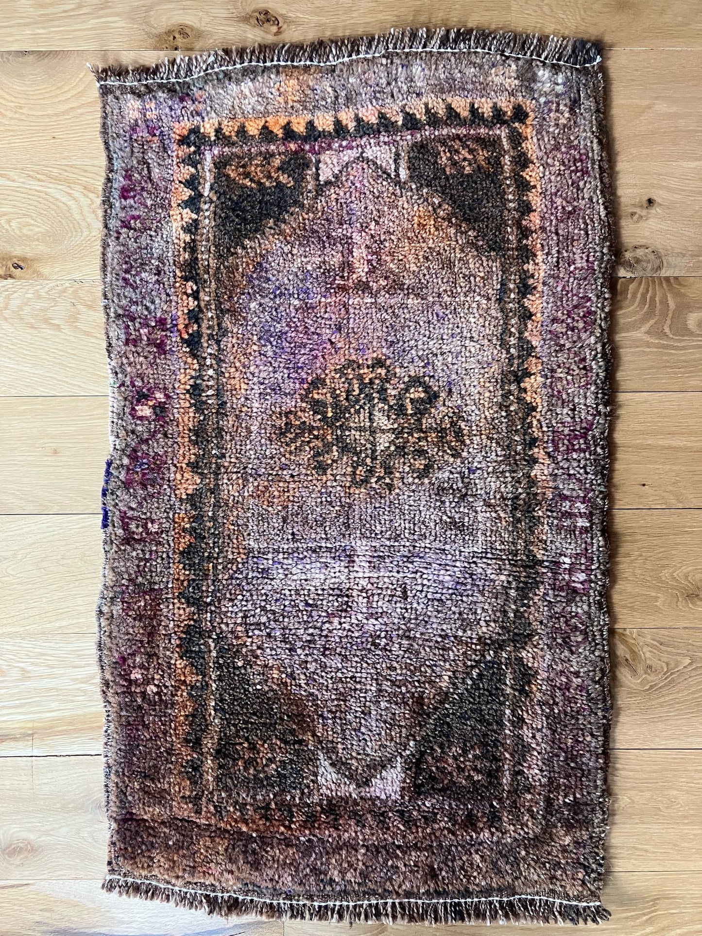 Handmade vintage Turkish entryway rug made of a cotton foundation and a wool pile.