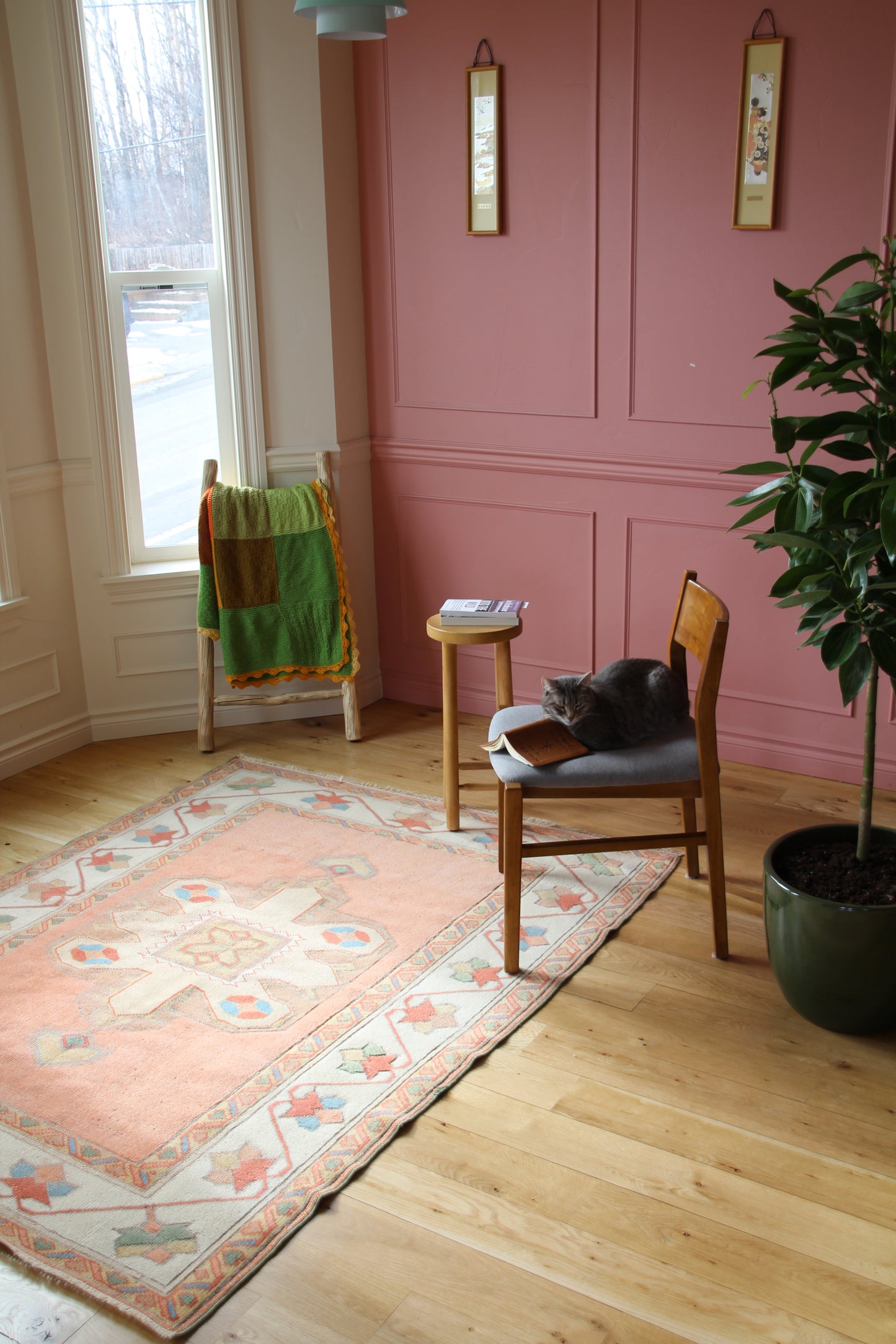 Handmade vintage Turkish medium rug made of 100% wool, featuring pink, blue, green, and beige colors.