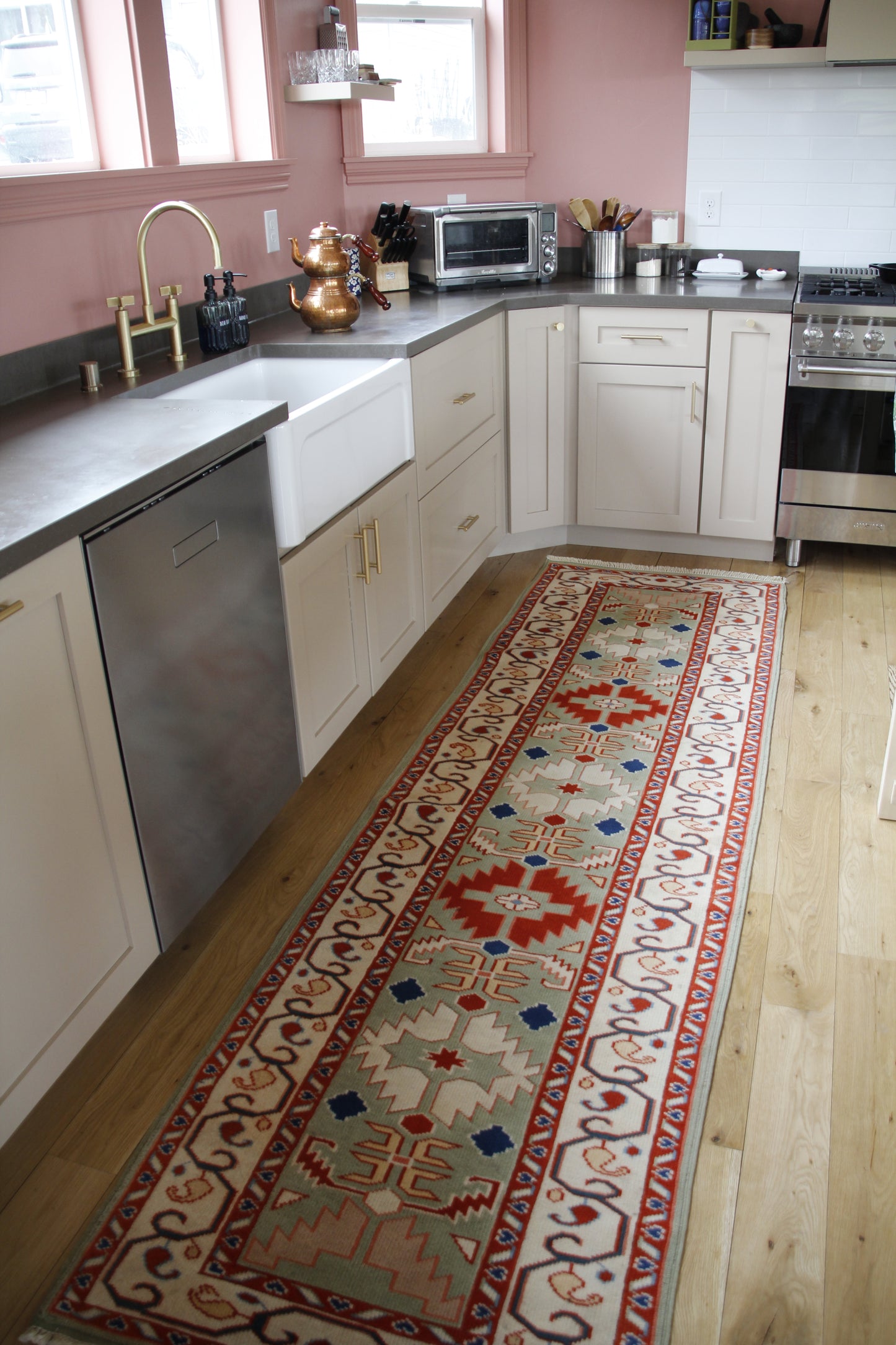 Handmade vintage Turkish runner made of 100% wool, featuring red, blue, and green colors.