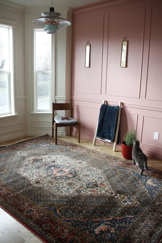 Handmade antique Persian large rug made of a cotton foundation and a wool pile.