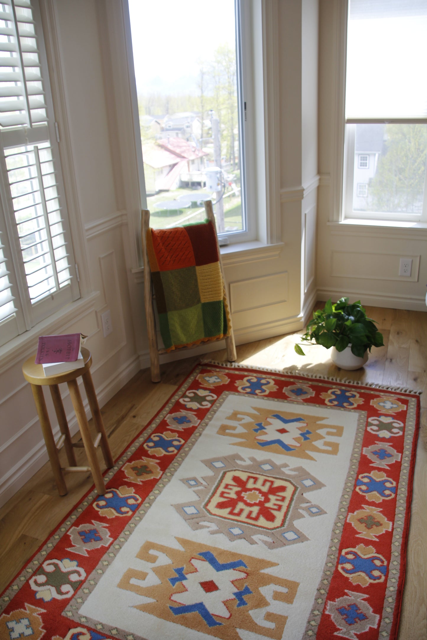 Handmade vintage Turkish entryway rug made of 100% wool, featuring red, blue, and beige colors.    