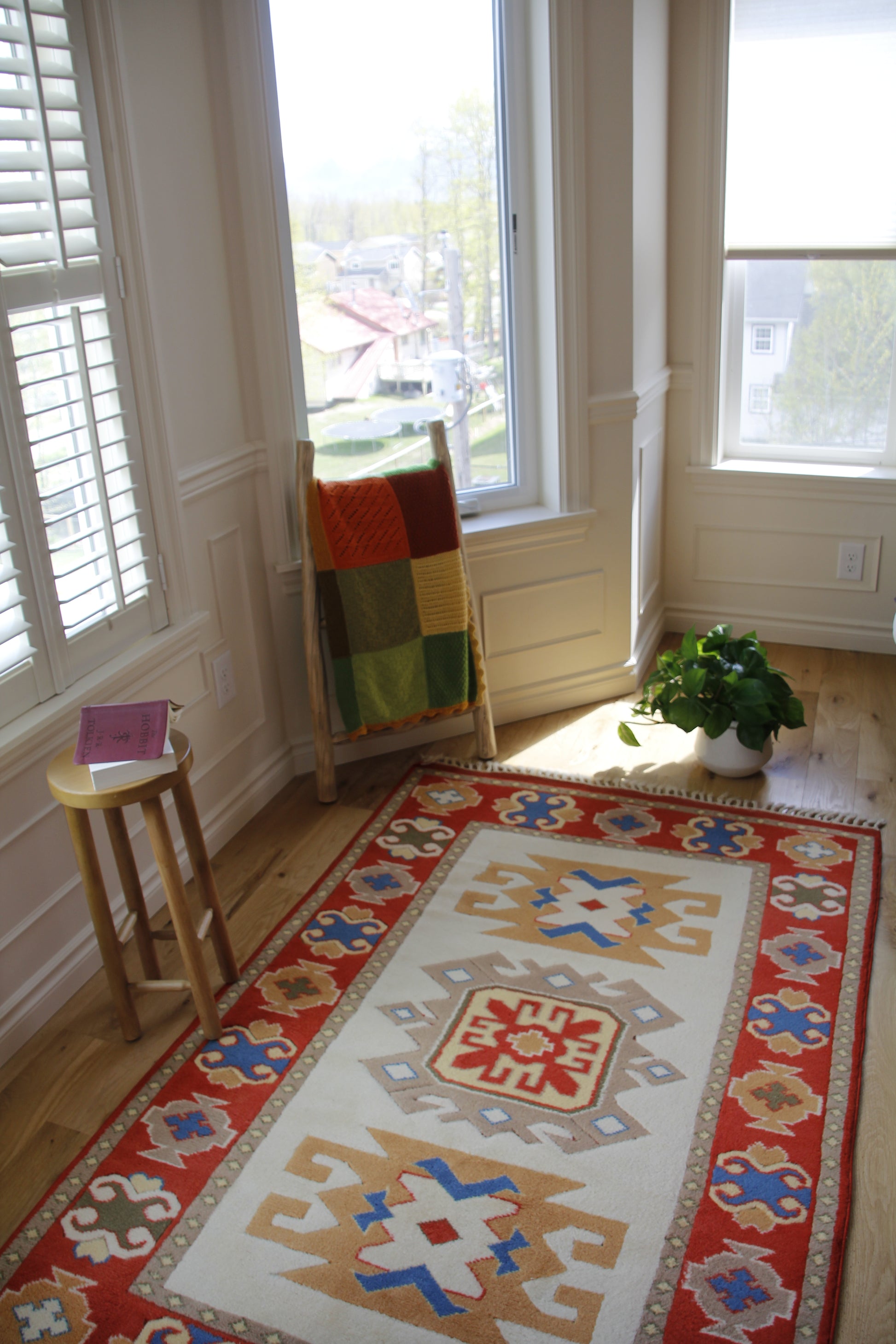 Handmade vintage Turkish entryway rug made of 100% wool, featuring red, blue, and beige colors.    