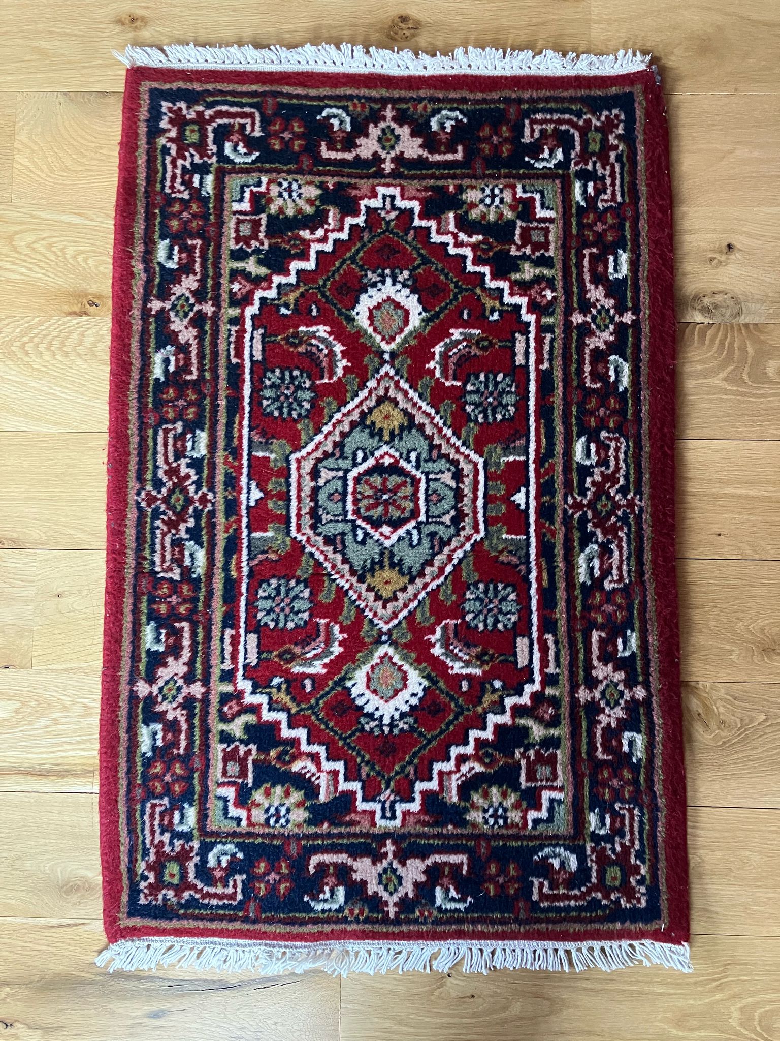 Handmade vintage Persian entryway rug made of a cotton foundation and a wool pile, featuring  red and blue colors.