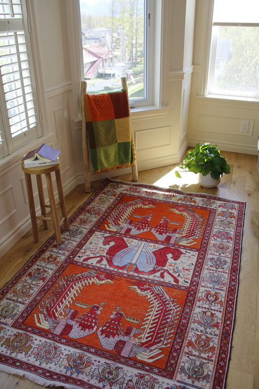 Handmade vintage Persian medium rug made of a cotton foundation and a silk pile, featuring  red, orange, and beige colors.