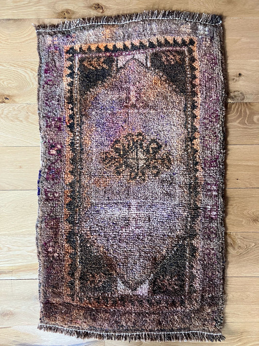 Handmade vintage Turkish entryway rug made of a cotton foundation and a wool pile.