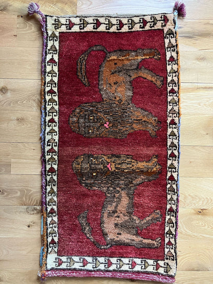 Handmade vintage Turkish entryway rug made of a cotton foundation and a wool pile, featuring  red and brown colors.