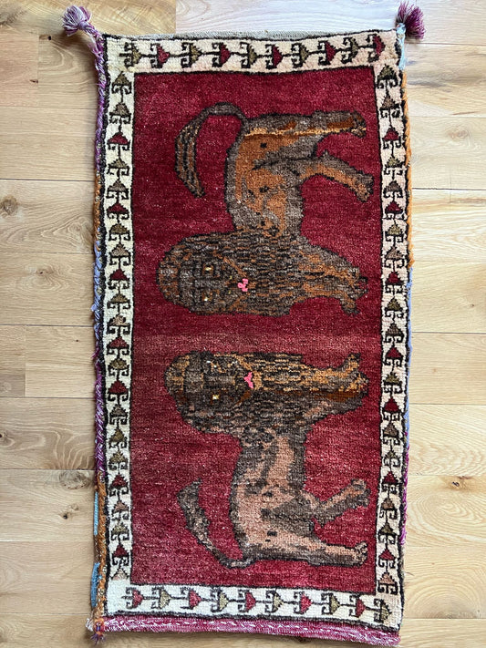 Handmade vintage Turkish entryway rug made of a cotton foundation and a wool pile, featuring  red and brown colors.