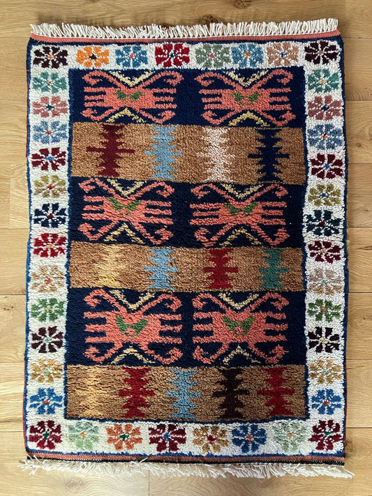 Handmade vintage Turkish entryway rug made of a cotton foundation and a wool pile, featuring  red, blue, brown and beige colors.