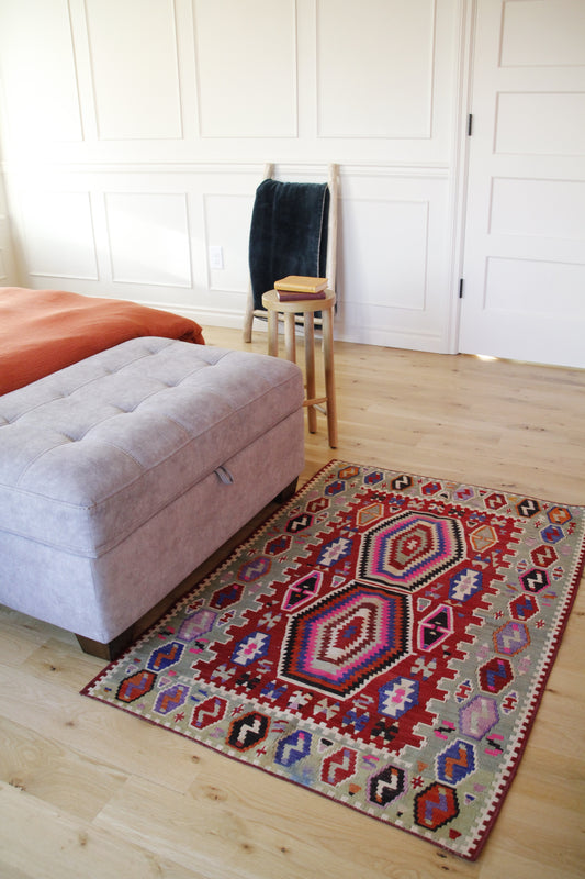 Handmade vintage Turkish kilim made of 100% wool, featuring red color.