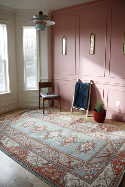 Handmade vintage Turkish large rug made of 100% wool, featuring blue and beige colors.    