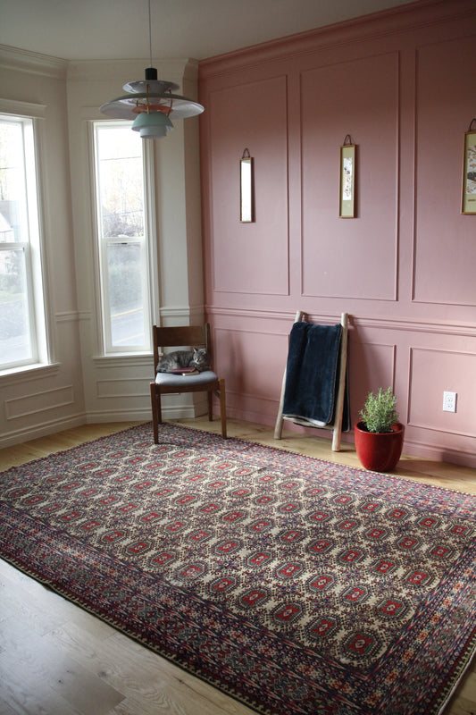 Handmade vintage Turkish large rug made of a cotton foundation and a wool pile, featuring  red, blue and pink colors.