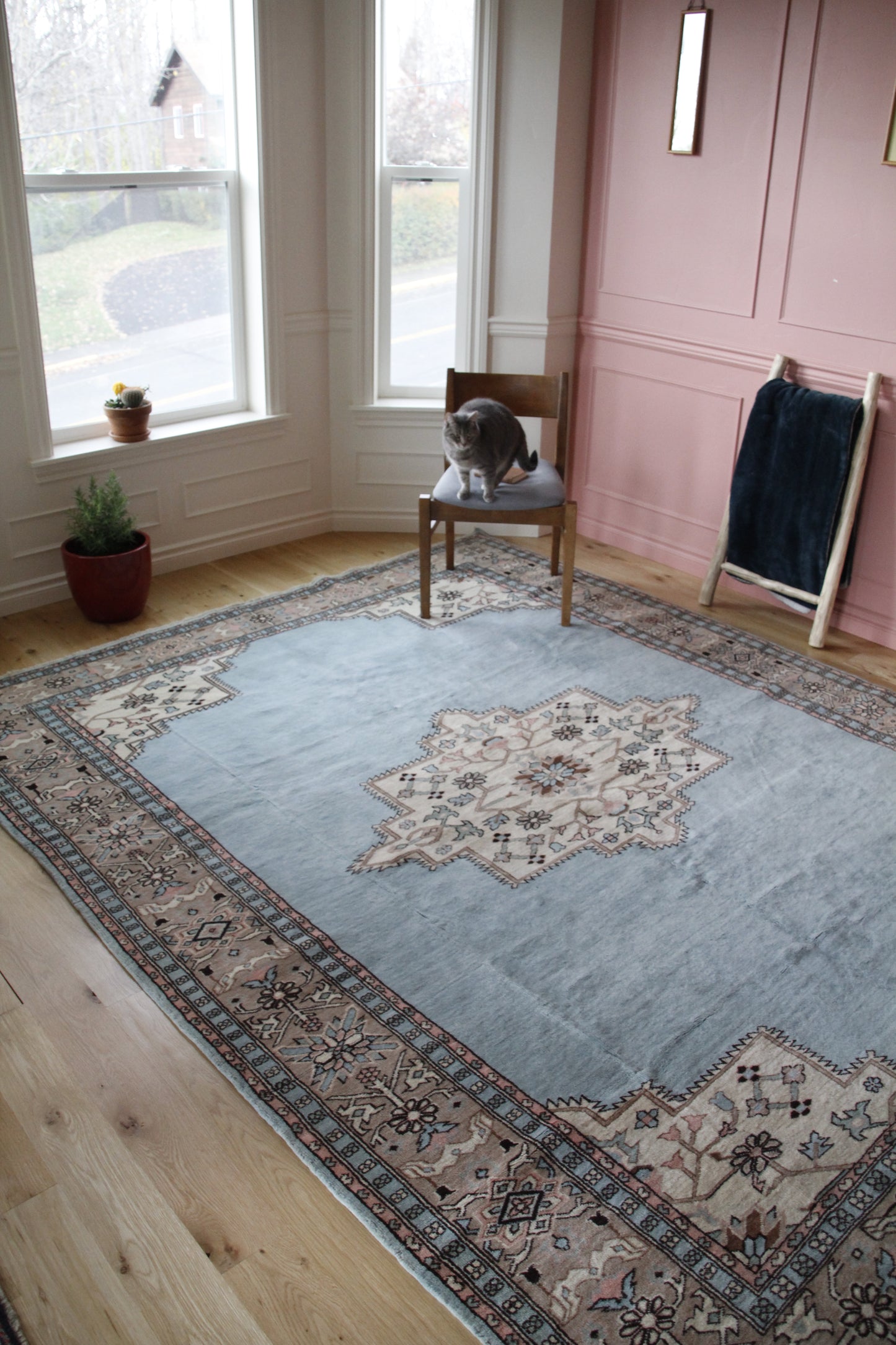 Handmade vintage Turkish large rug made of 100% wool, featuring blue and beige colors. 