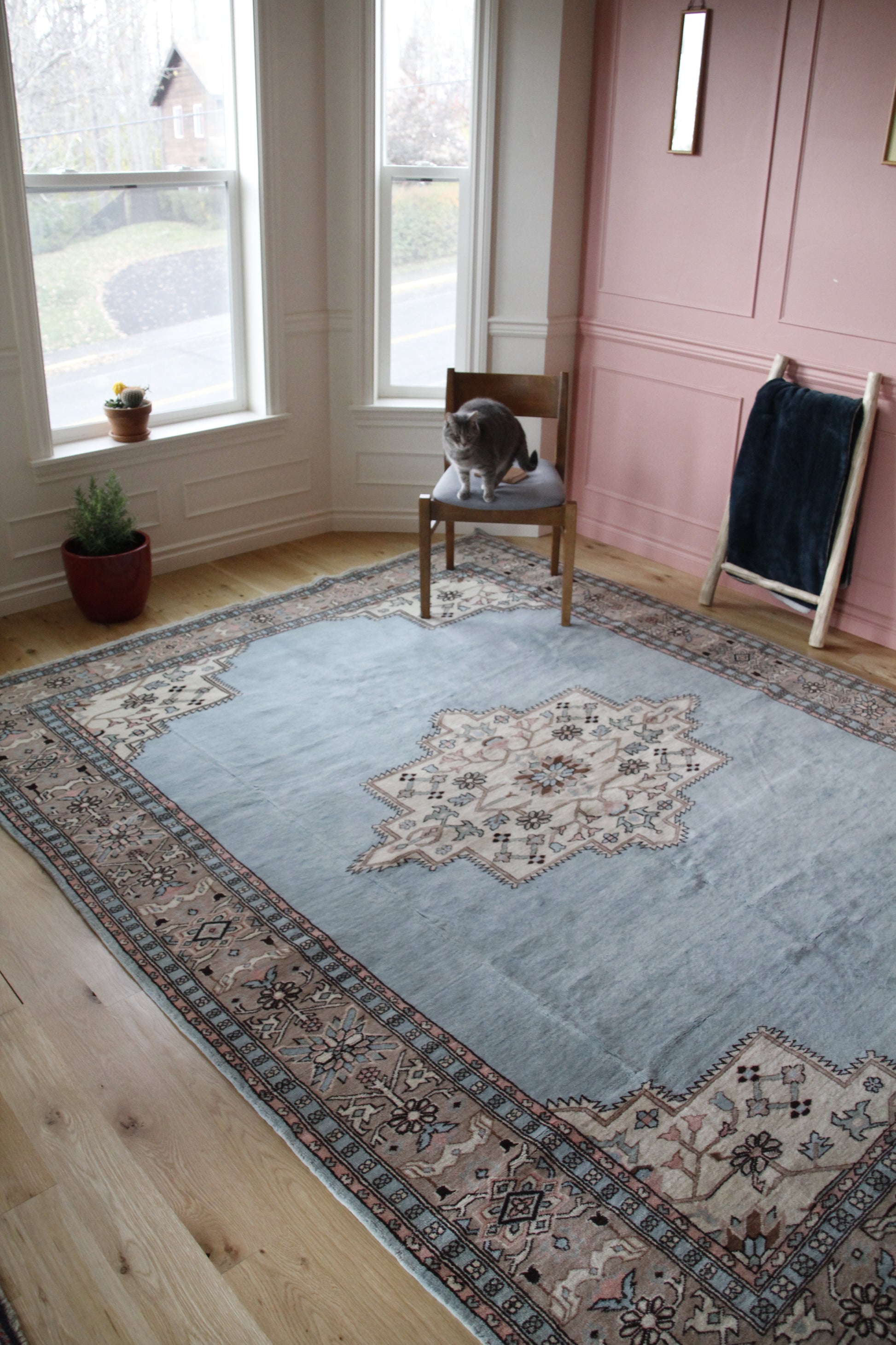 Handmade vintage Turkish large rug made of 100% wool, featuring blue and beige colors. 