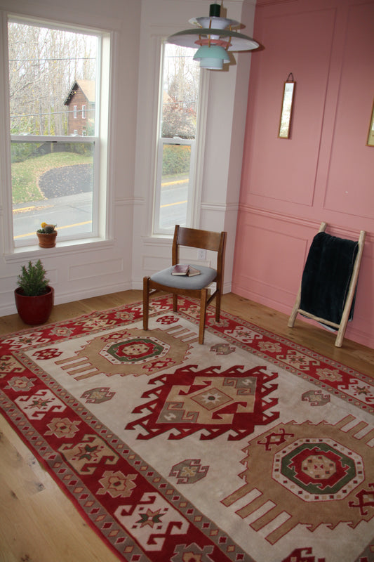 Handmade vintage Turkish large rug made of 100% wool, featuring red and beige colors. 