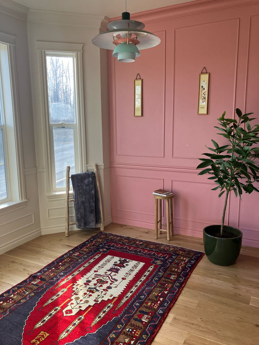 Handmade vintage Turkish medium rug made of 100% wool, featuring red and blue colors.