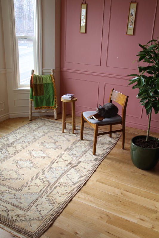 Handmade vintage Turkish medium rug made of 100% wool, featuring beige color.