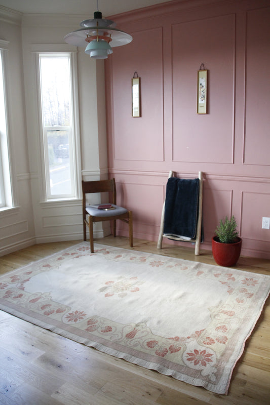 Handmade vintage Turkish medium rug made of 100% wool, featuring red and light colors. 