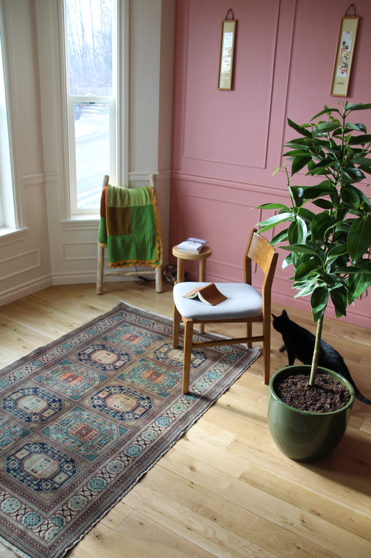 Handmade vintage Turkish medium rug made of a cotton foundation and a wool pile, featuring  green, blue, and beige colors.