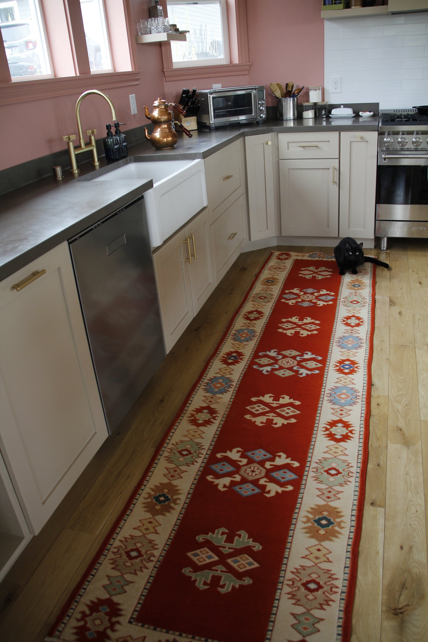 Handmade vintage Turkish runner made of 100% wool, featuring red, blue, and beige colors.    