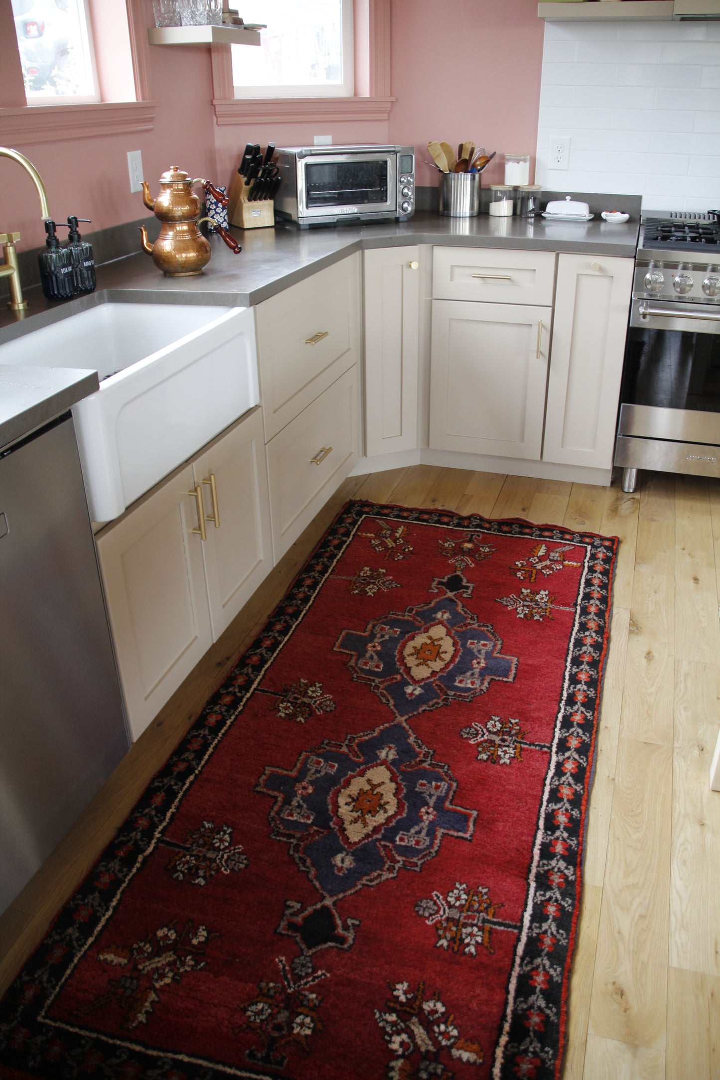 Handmade vintage Turkish runner made of 100% wool, featuring red, blue, and black colors.    