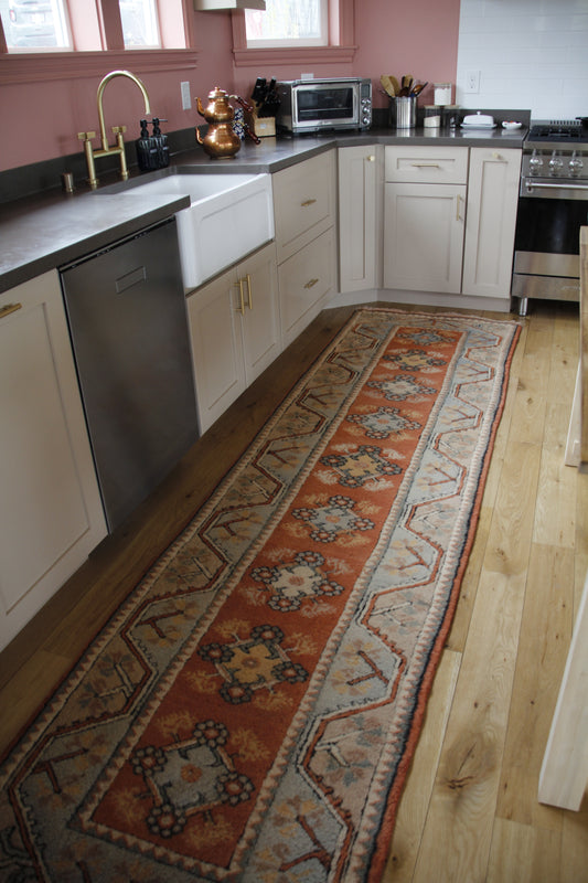 Handmade vintage Turkish runner made of 100% wool, featuring orange and beige colors.    