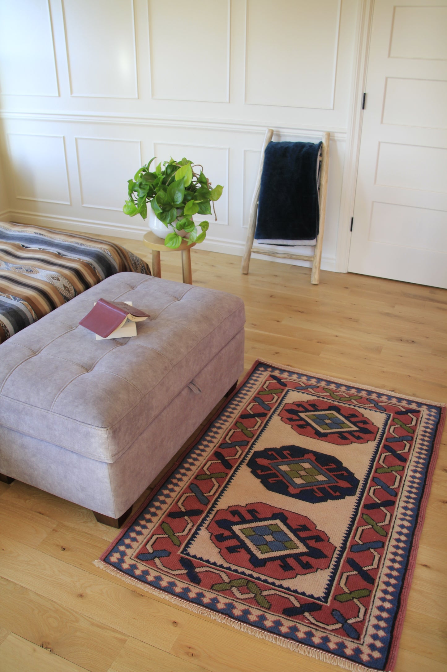 Handmade vintage Turkish small rug made of a cotton foundation and a wool pile, featuring  pink, blue, and beige colors.