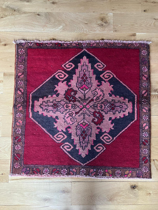 Handmade vintage Turkish entryway rug made of a cotton foundation and a wool pile, featuring  red and black colors.