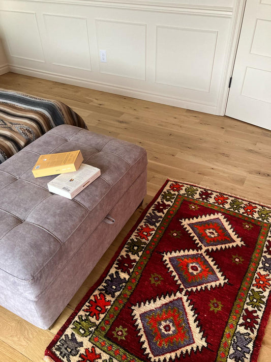 Handmade vintage Turkish small rug made of 100% wool, featuring red, green, and orange colors.   