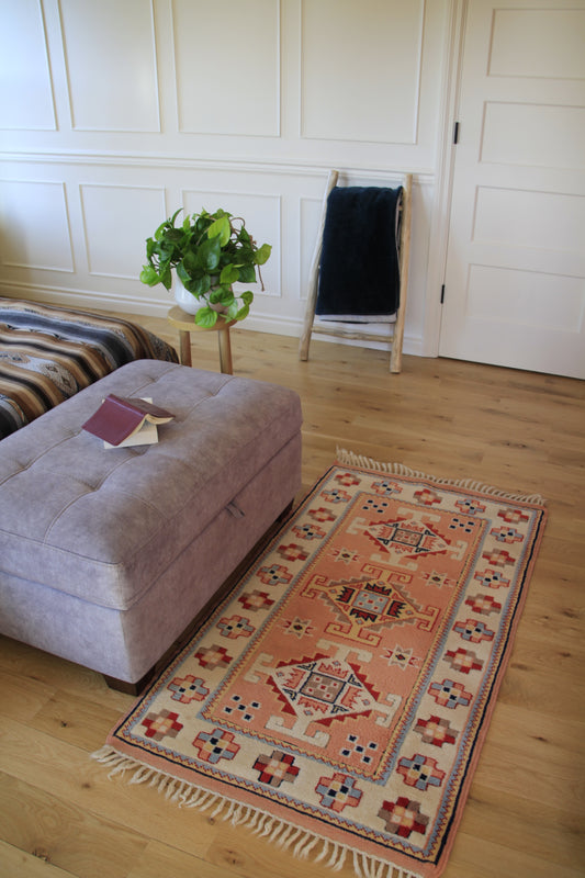Handmade vintage Turkish small rug made of 100% wool.