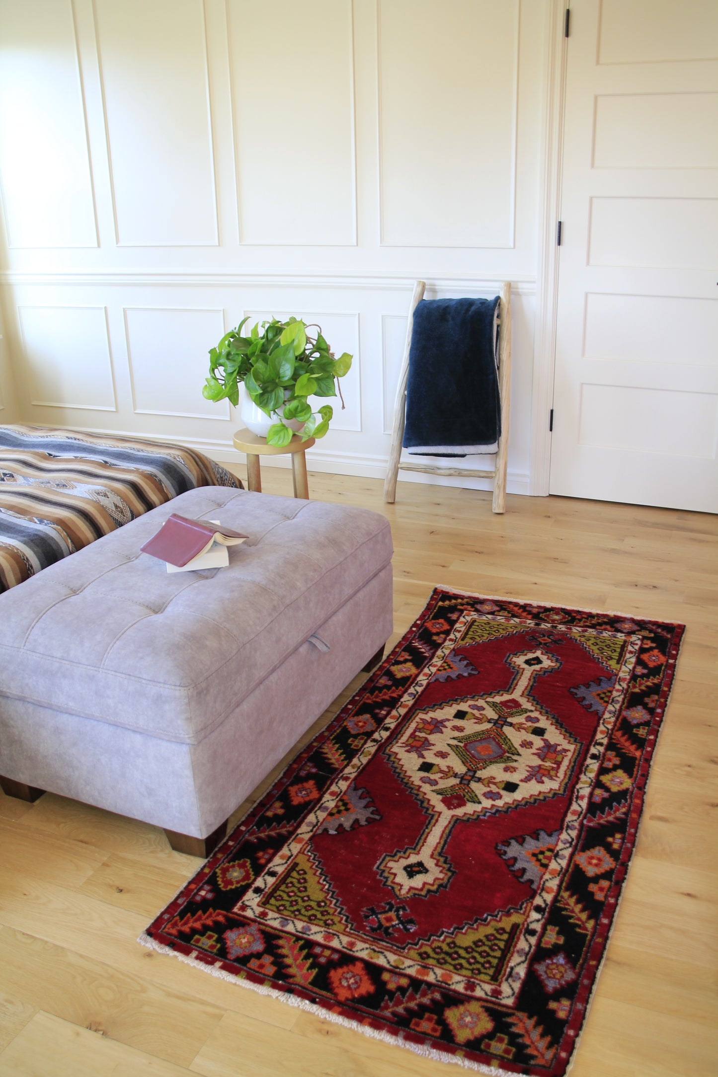 Handmade vintage Turkish small rug made of a cotton foundation and a wool pile, featuring  red and black colors.