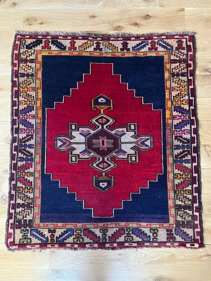 Handmade vintage Turkish entryway rug made of a cotton foundation and a wool pile, featuring  red and blue colors.