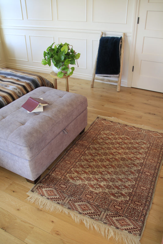 Handmade vintage Turkoman small rug made of 100% wool, featuring beige and brown colors.